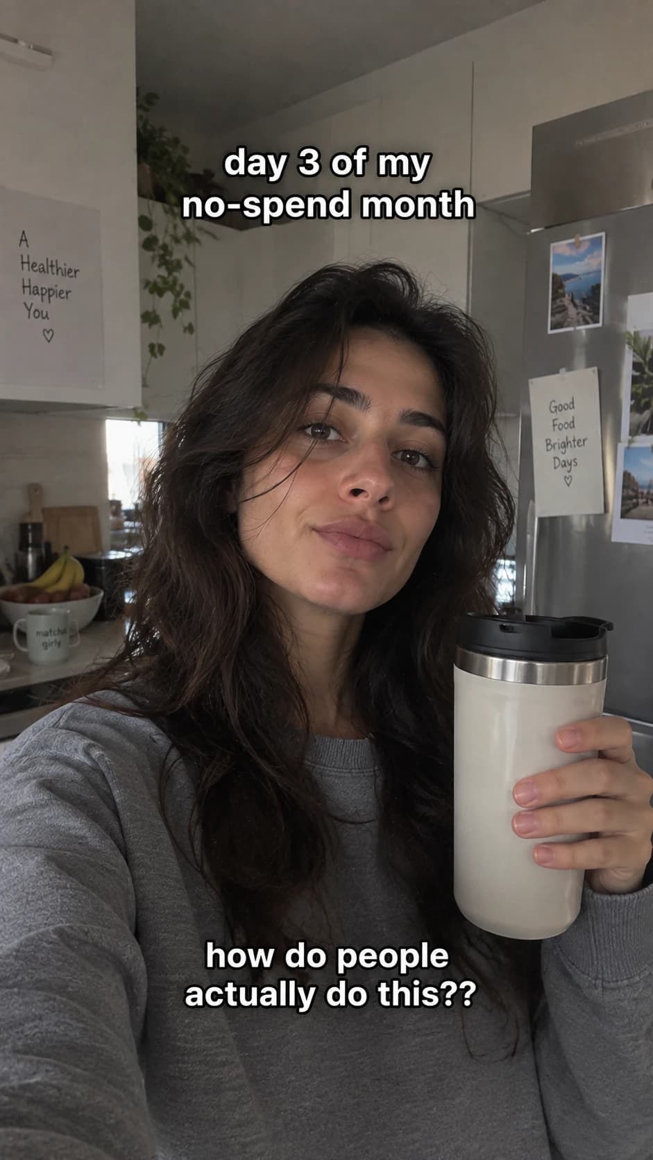 Selfie in a kitchen captioned 'day 3 of my no-spend month'